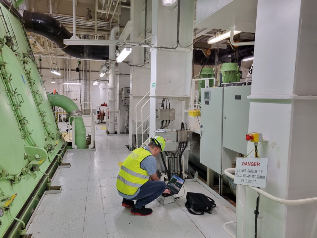 Service engineer working in an engine room