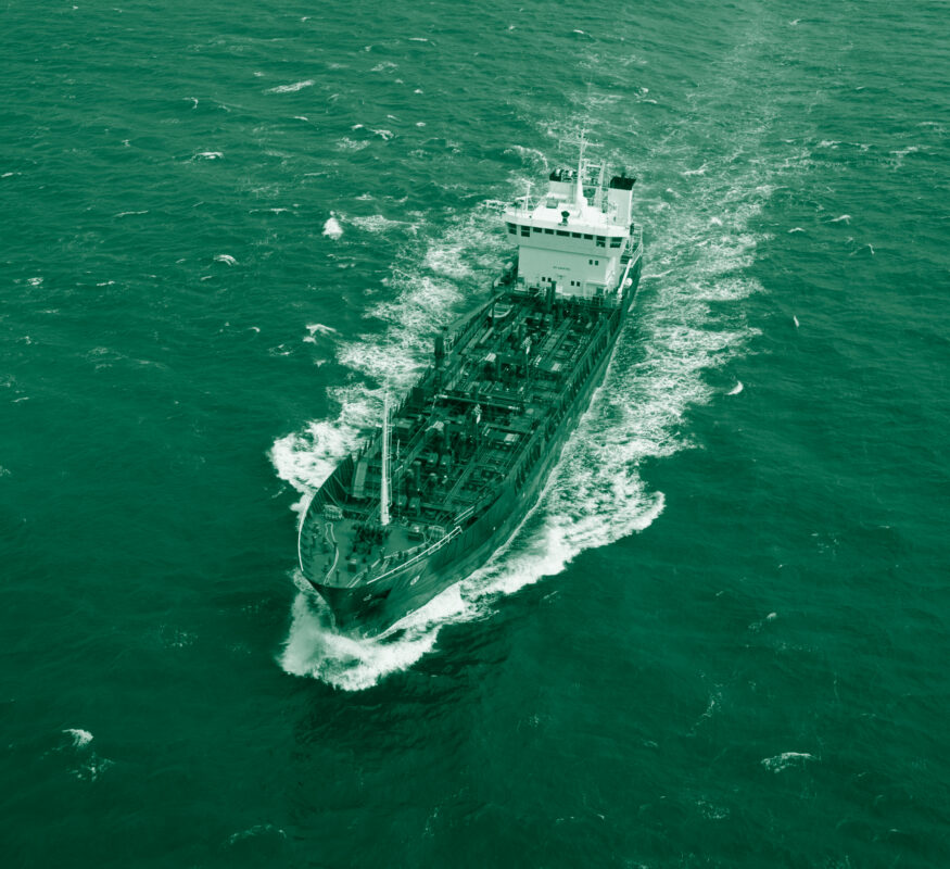 Commercial vessel in green ocean