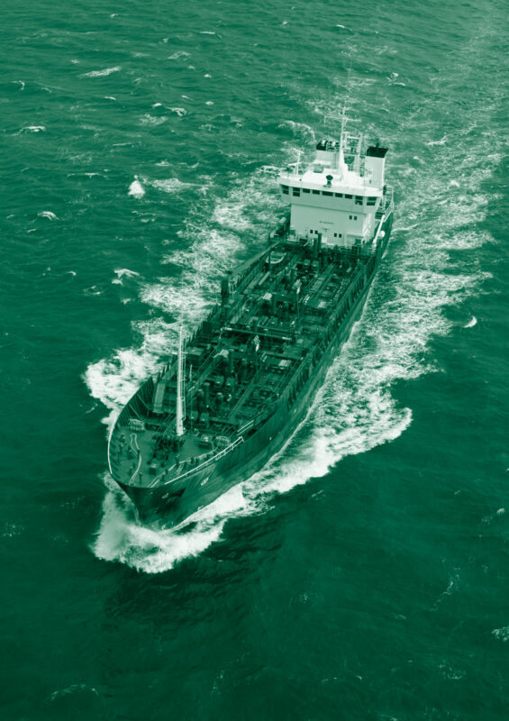 Commercial vessel in green ocean