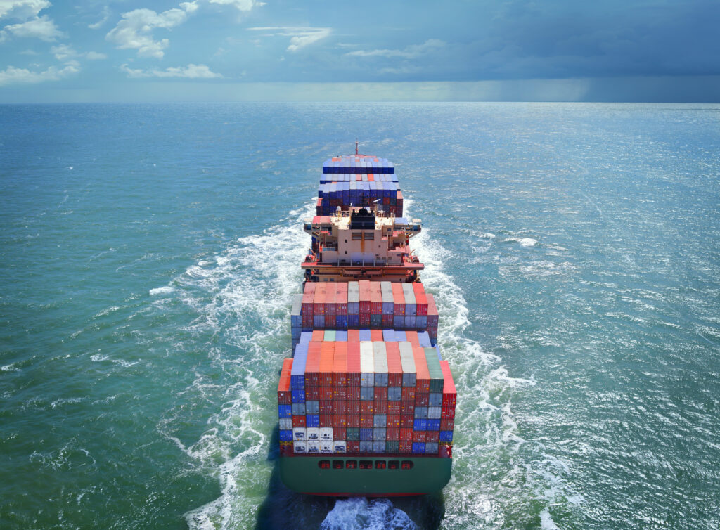 Cargo vessel in green ocean