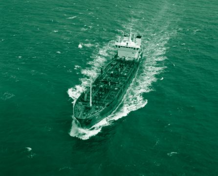 Commercial vessel in green ocean